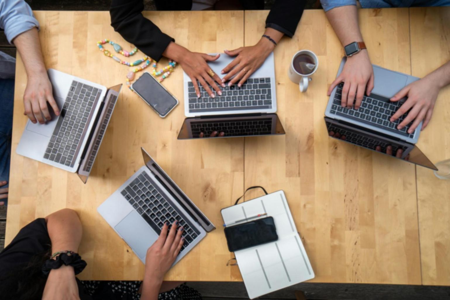 Diverse group of entrepreneurs collaborating on startup funding strategies